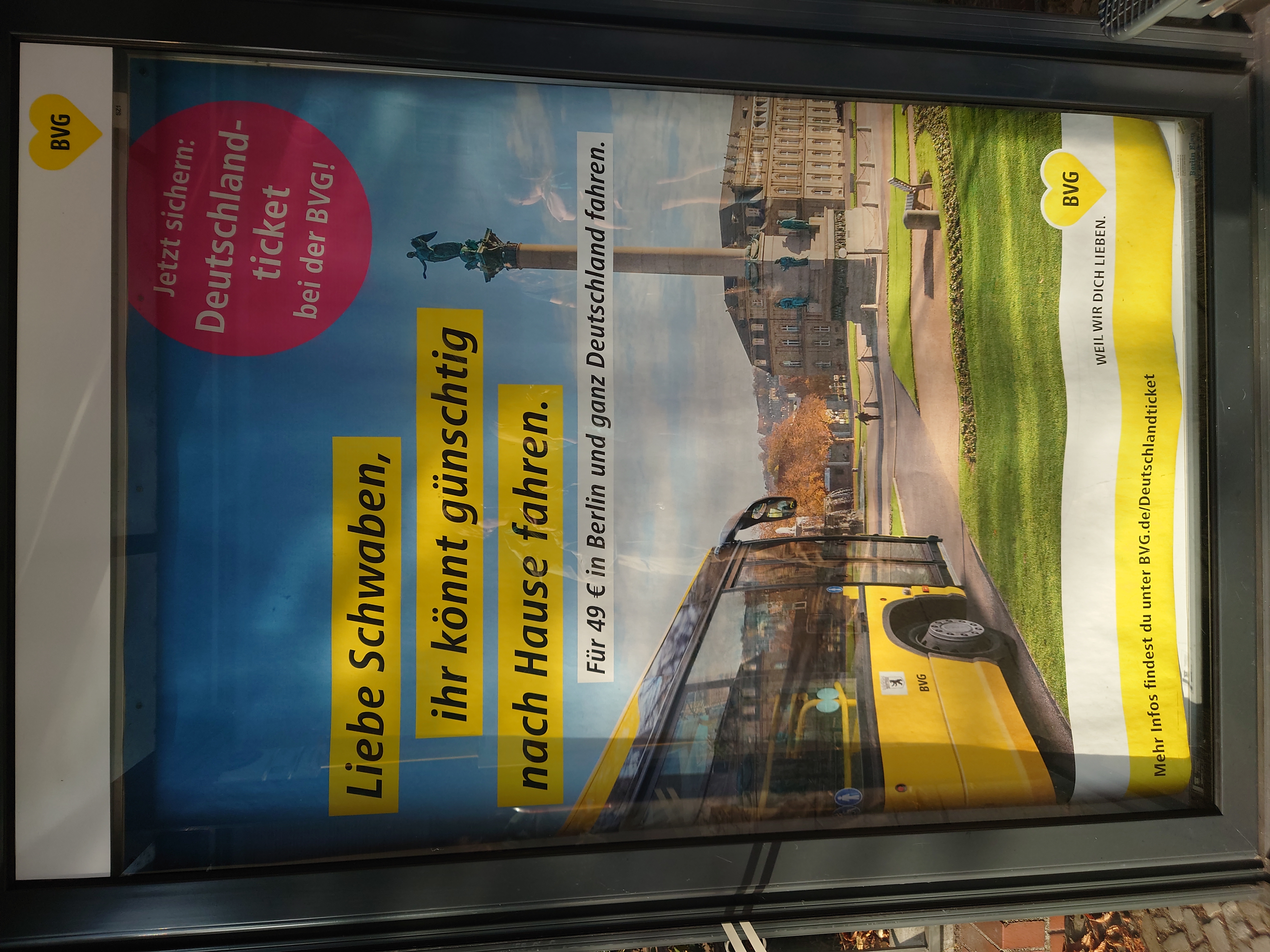 BVG-advertisment poster at Berlin bus stop: translation "Dear Swabians, you can now get a ride back home cheaply"